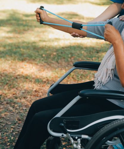 a person hand cycling while on wheelchair 